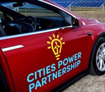 Side of a car with City Power Partnerships logo